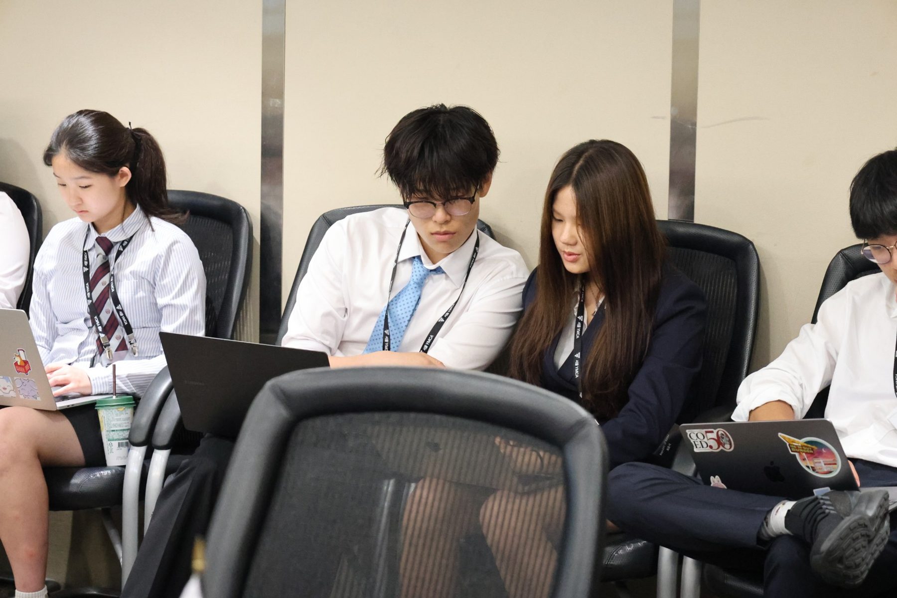 Ari going over notes with another delegate during a session