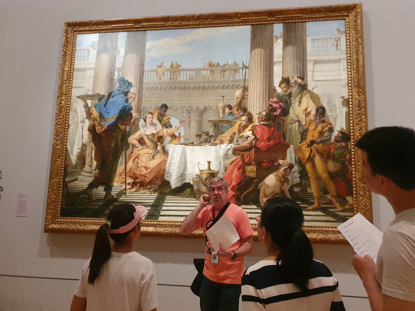 Students in front of a large Baroque painting in a museum