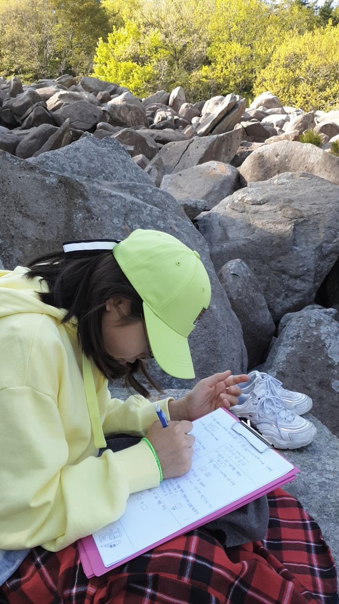 Taking notes outdoors on a clipboard