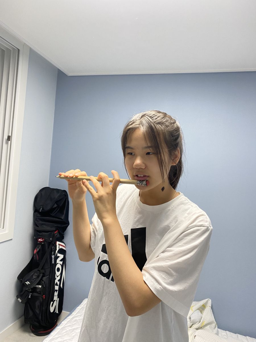Ari playing the flute